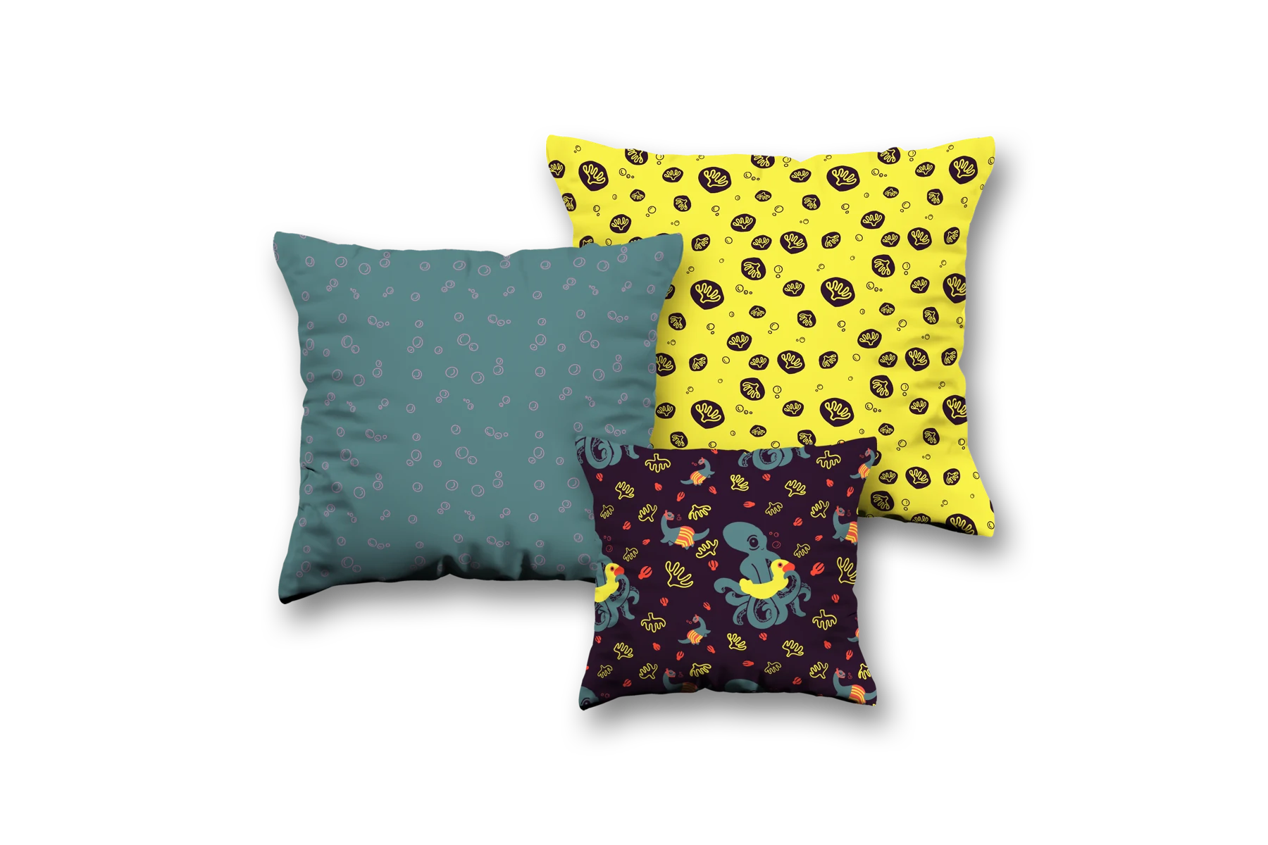 Three Weird Swimmers cushions with teal bubbles, yellow sea motifs, and playful underwater characters on dark plum